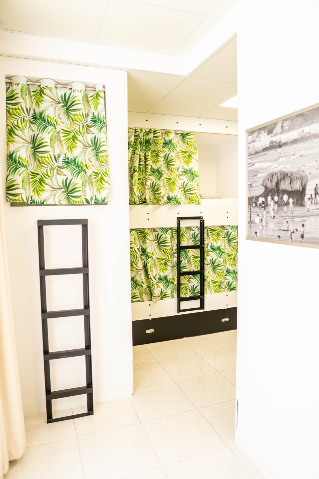 Hostel bedroom with a window opening toward the Cantabrian coast